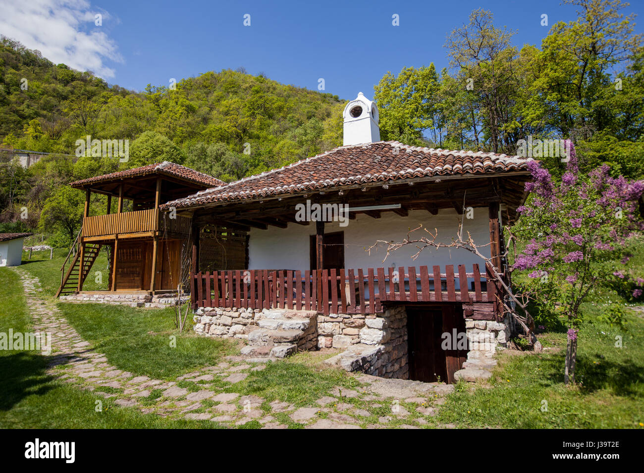 Traditional house in village at eastern Serbia, a combination of wood and stone, near Donji Milanovac. Stock Photo