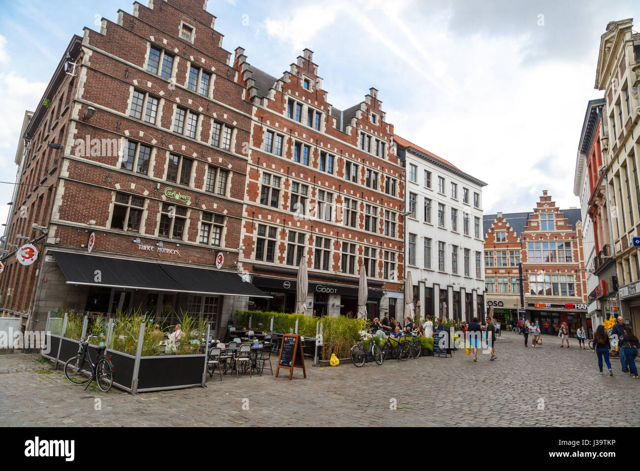 GENT, BELGIUM - JULY 6, 2016 : Medieval Ghent streets with colorful buildings and people. Gent is popular place in Belgium. Stock Photo