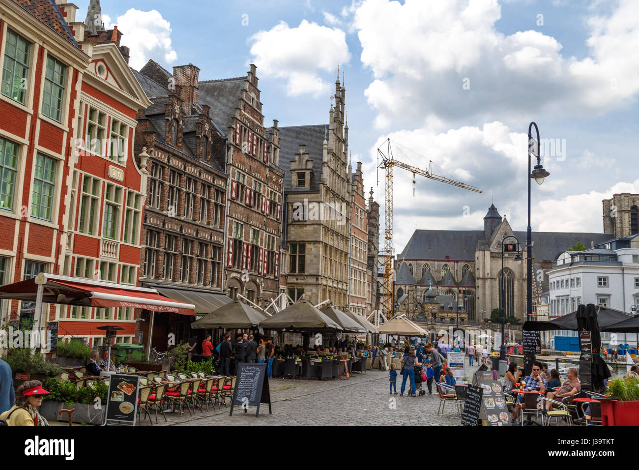 GENT, BELGIUM - JULY 6, 2016 : Medieval Ghent streets with colorful buildings and people. Gent is popular place in Belgium. Stock Photo