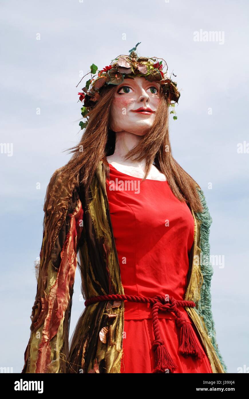 Flora, the Singleton Giant, is paraded on the West Hill during the annual Jack In The Green festival at Hastings in England on May 5, 2014. Stock Photo