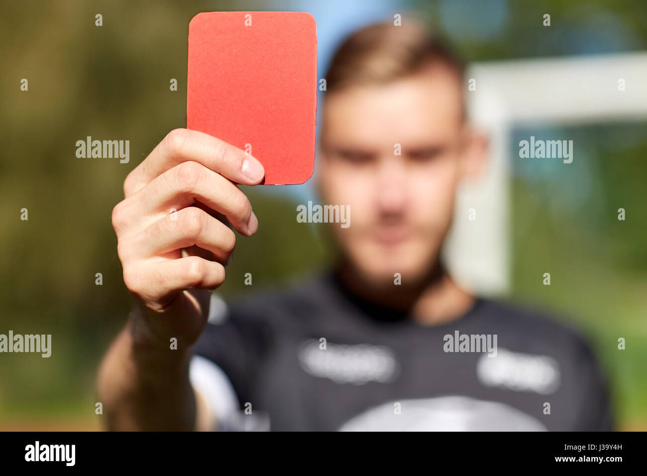 referee hands with red card on football field Stock Photo Alamy
