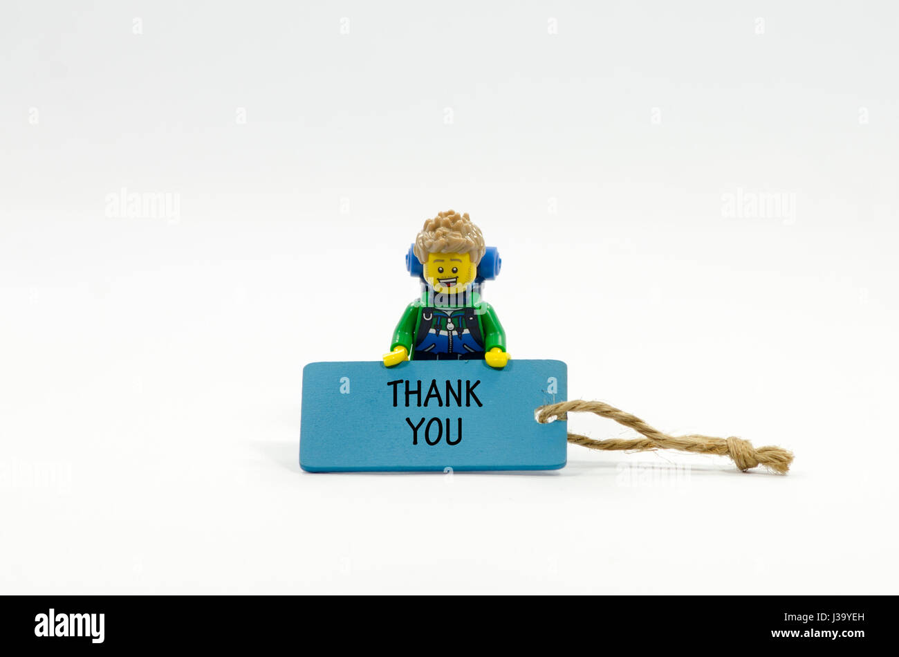 lego hiker holding wooden tag written word thank you Stock Photo - Alamy