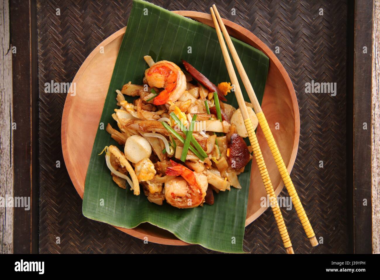 Char Kway Teow. Stirfried flat rice noodles with shrimps, sausage