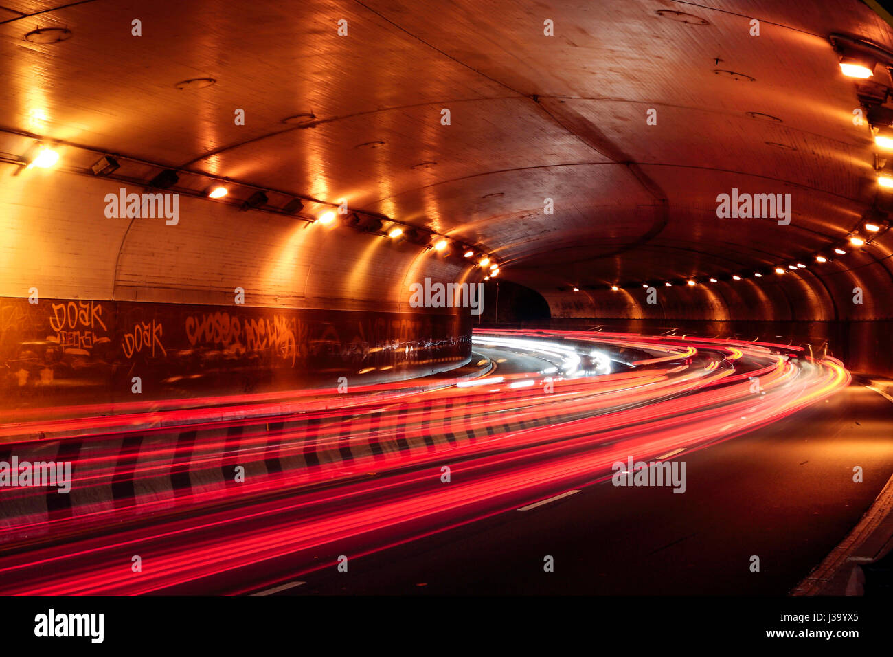 long exposure image of streak of light through a tunnel at night Stock ...