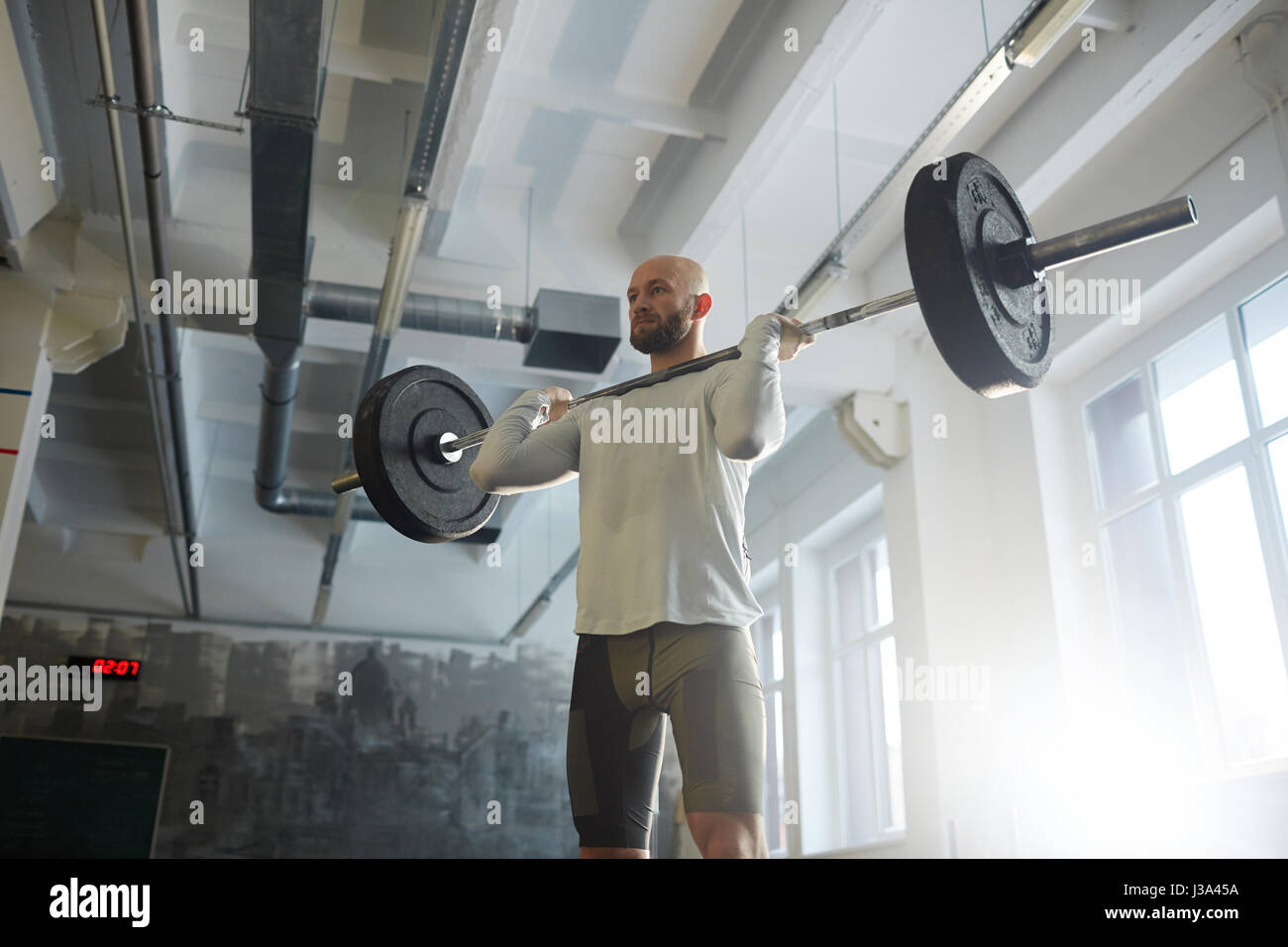 Modern Powerlifter Lifting Barbell in Gym Stock Photo Alamy
