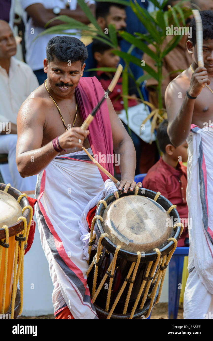 Drummer at a traditional Theyyam festival - a colourful ritual dance ceremony popular in North Malabar, Kerala, South India, South Asia. Stock Photo