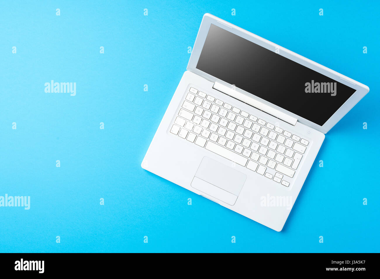 Pretty Blue Computer Modern computer on blue background Stock Photo - Alamy