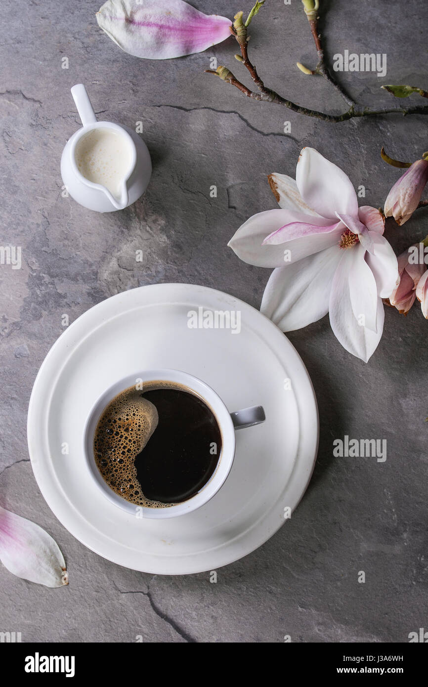 Cup of black coffee with magnolia Stock Photo