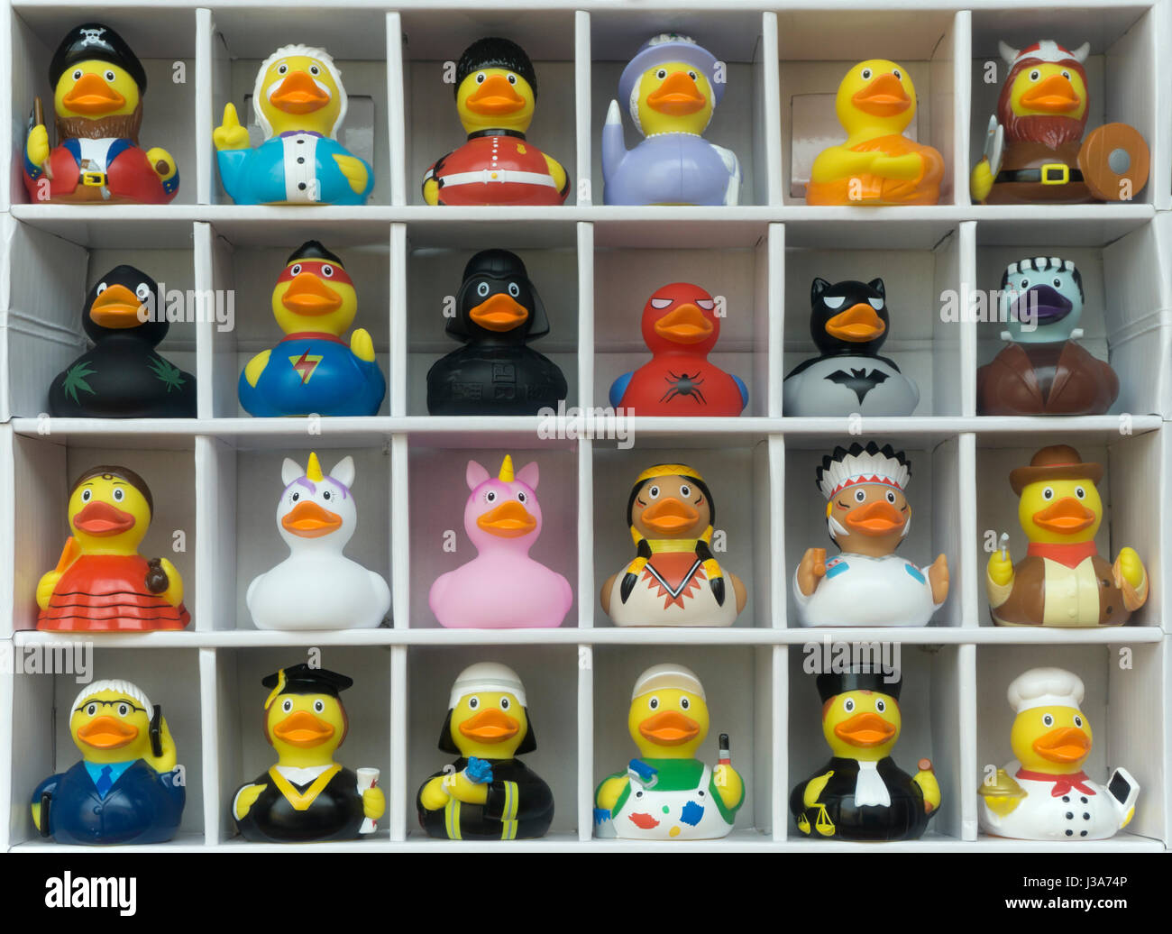 toy plastic ducks dressed for different careers Stock Photo
