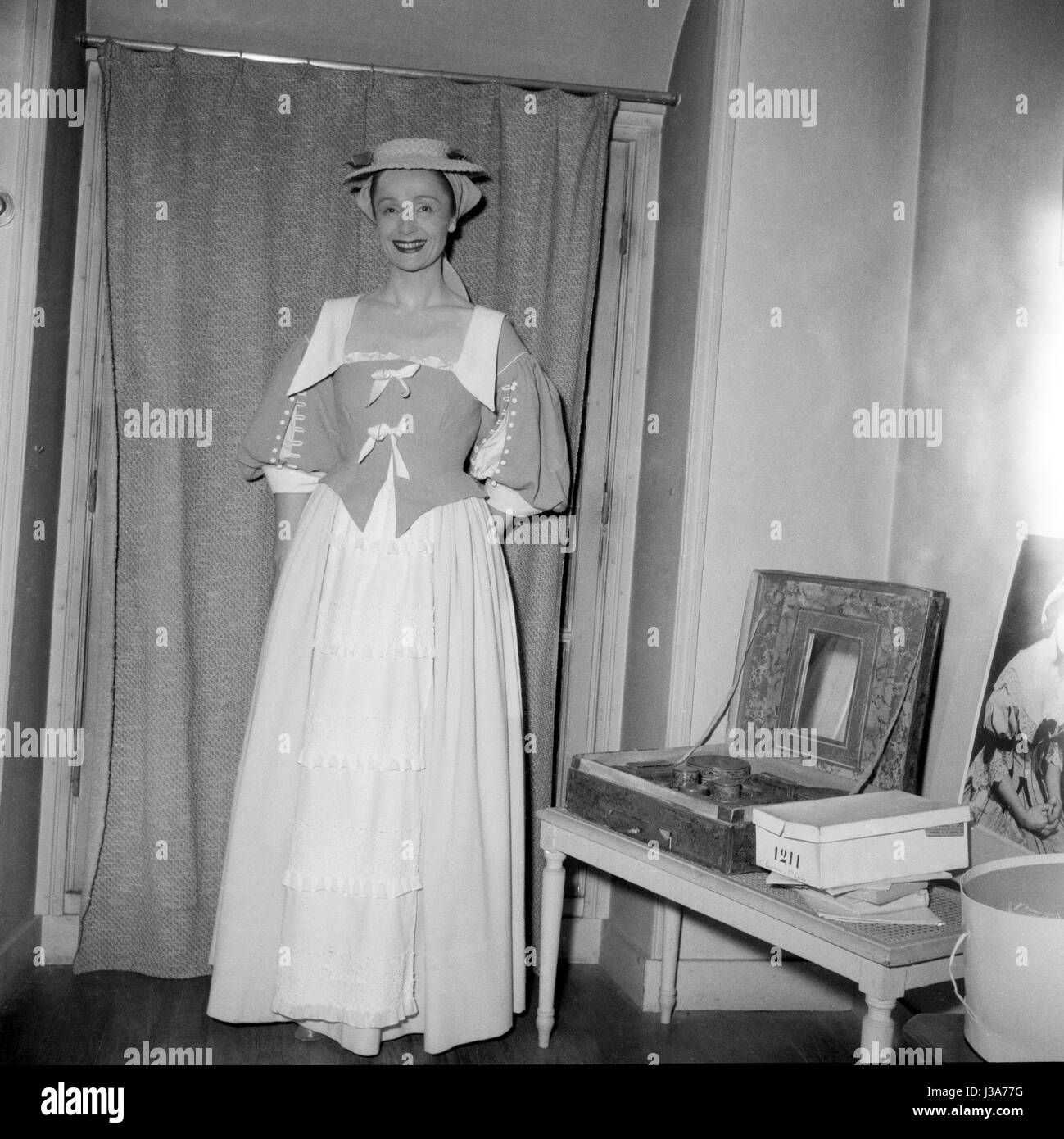 Gisèle Casadesus in her dressing room at the Comédie-Française in Paris in  1953. She is wearing the costume of Perrette in the play 'La Coupe  Enchantée' by Jean de la Fontaine and