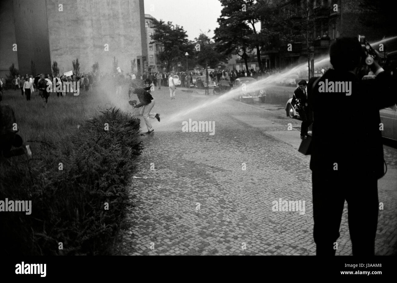 Police forces are using water canons in Berlin, 1967 Stock Photo