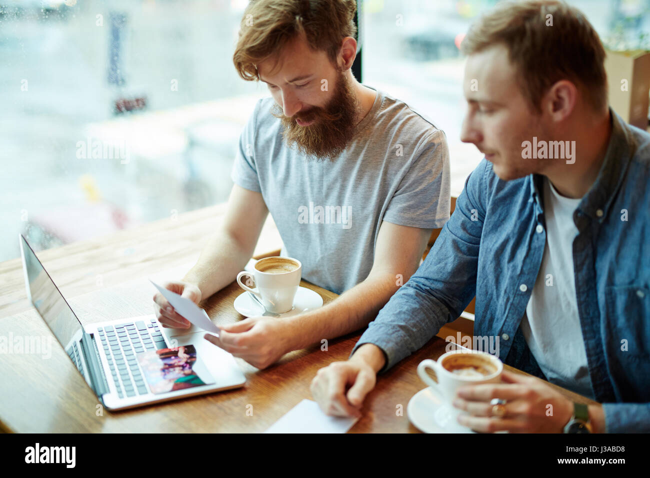 Bearded Friends Gathered in Cozy Coffeehouse Stock Photo - Alamy
