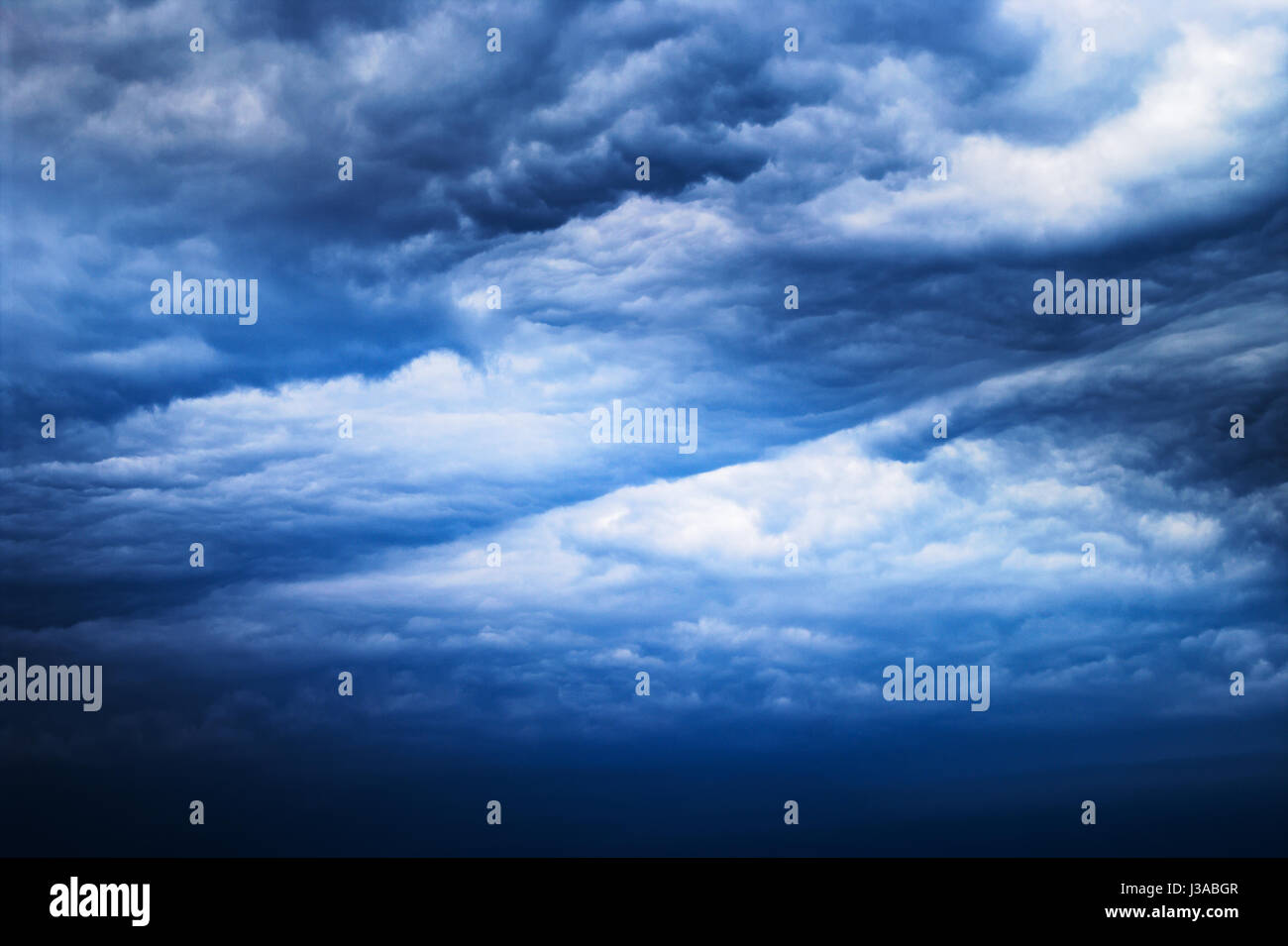Cloudscape with dark, dramatic, stormy clouds. Nimbostratus cloud formation. Stock Photo