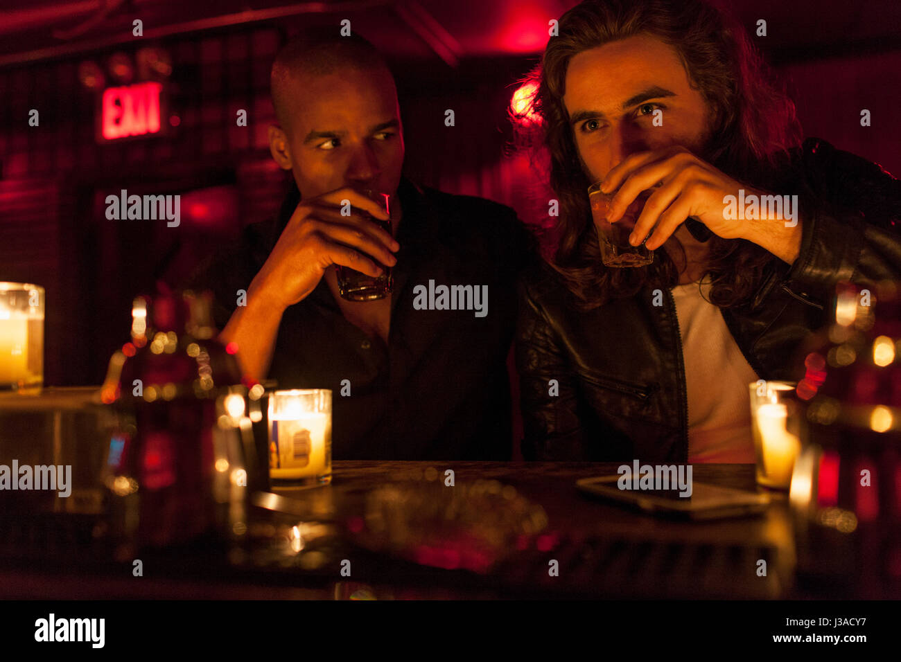 Young men hanging out at a nightclub Stock Photo