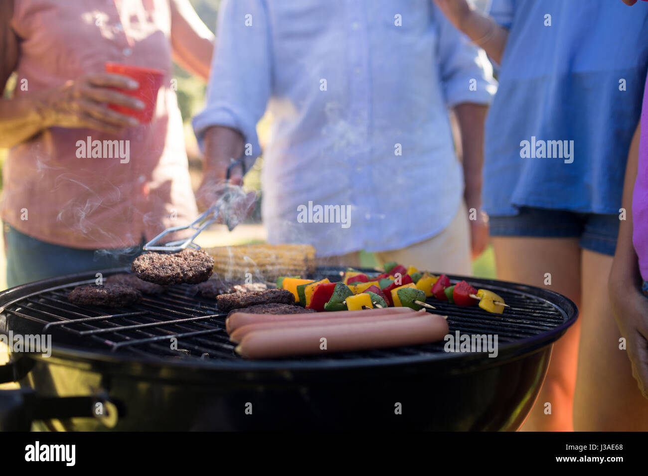 Close up family grilling patties hires stock photography and images Alamy