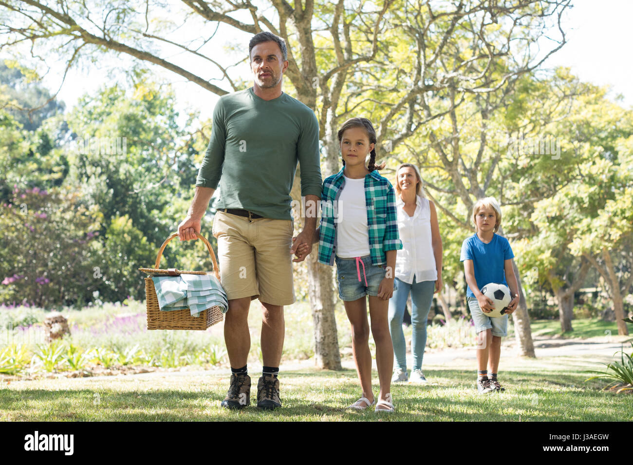 Family arriving in the park for picnic on a sunny day Stock Photo - Alamy