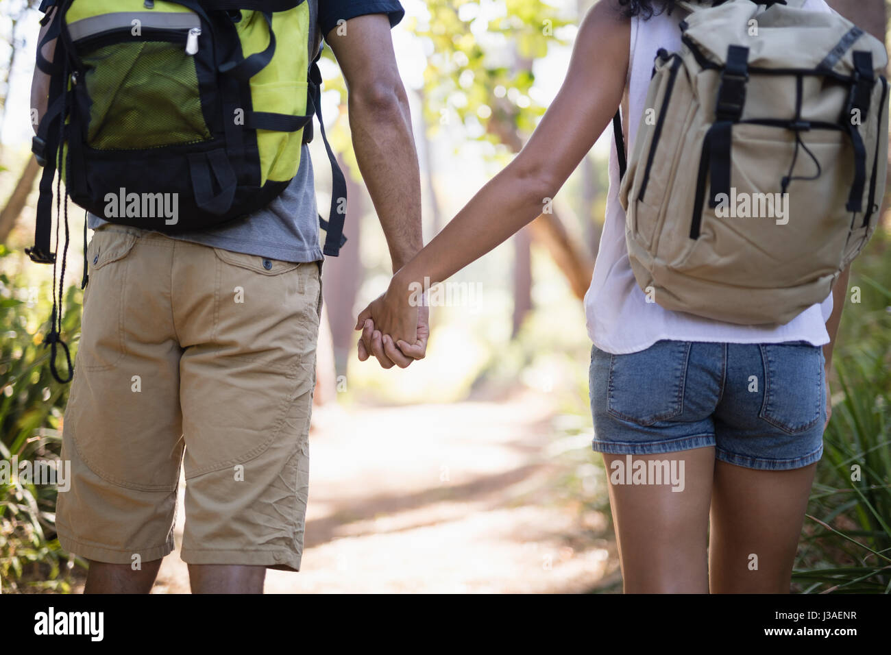 Indian couple holding hands walking hi-res stock photography and images ...
