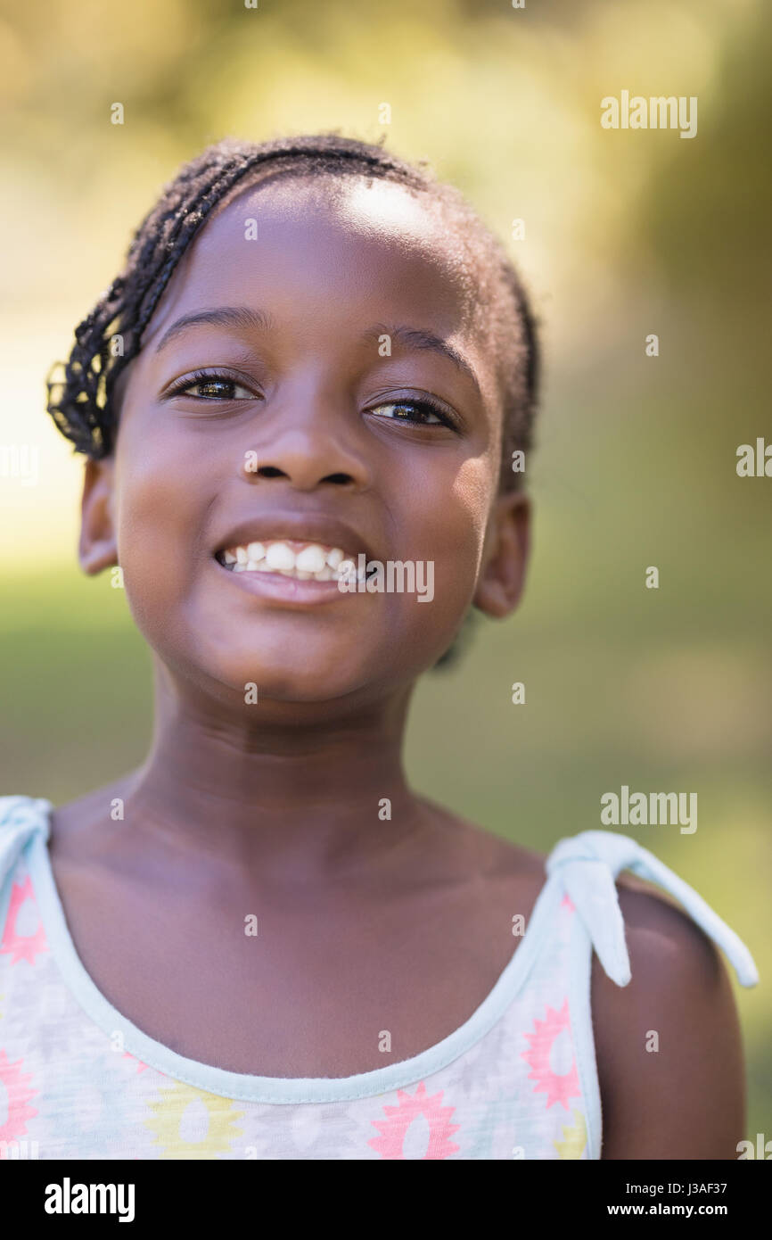 Close up portrait of smiling girl standing in forest Stock Photo - Alamy