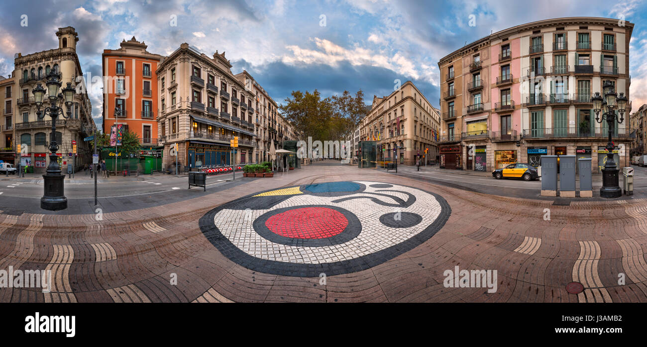 BARCELONA, SPAIN - NOVEMBER 17, 2014: Joan Miro's Pla de l'Os mosaic in La Rambla in Barcelona, Spain. Thousands of people walk daily on the mosaic, d Stock Photo
