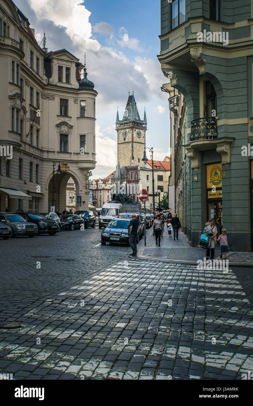 People throng the streets in Prague with a view towards Old Town Square and the Old Town Hall and Astronomical Clock. Stock Photo