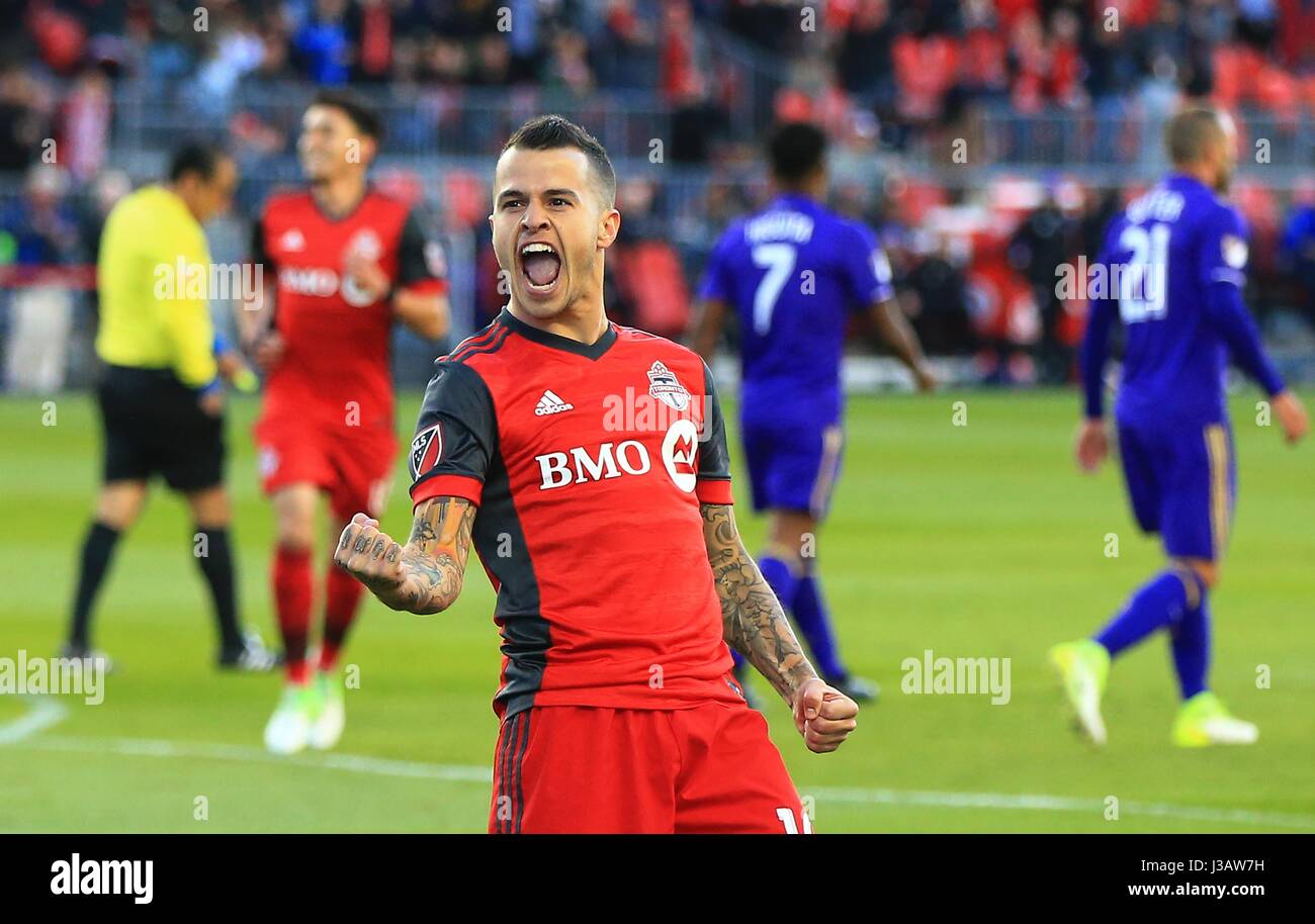 (170504) -- TORONTO, May 4, 2017 (Xinhua)-- Sebastian Giovinco(Front) of Toronto FC celebrates scoring during the 2017 Major League Soccer (MLS) match between Toronto FC and Orlando City SC at BMO Field in Toronto, Canada, May 3, 2017. Toronto FC won 2-1. (Xinhua/Zou Zheng) Stock Photo