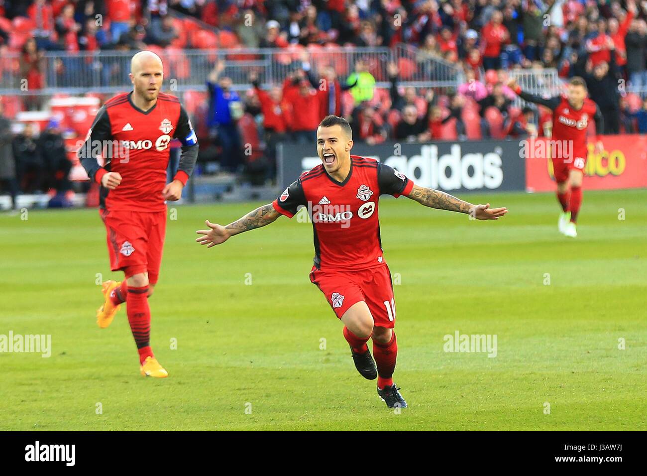 (170504) -- TORONTO, May 4, 2017(Xinhua)-- Sebastian Giovinco (C) of Toronto FC celebrates scoring during the 2017 Major League Soccer (MLS) match between Toronto FC and Orlando City SC at BMO Field in Toronto, Canada, May 3, 2017. Toronto FC won 2-1. (Xinhua/Zou Zheng) Stock Photo