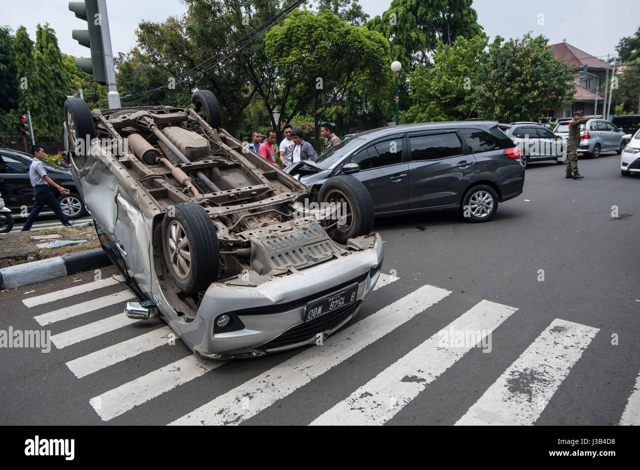 jakarta-indonesia-5th-may-2017-a-car-overturned-by-a-collision