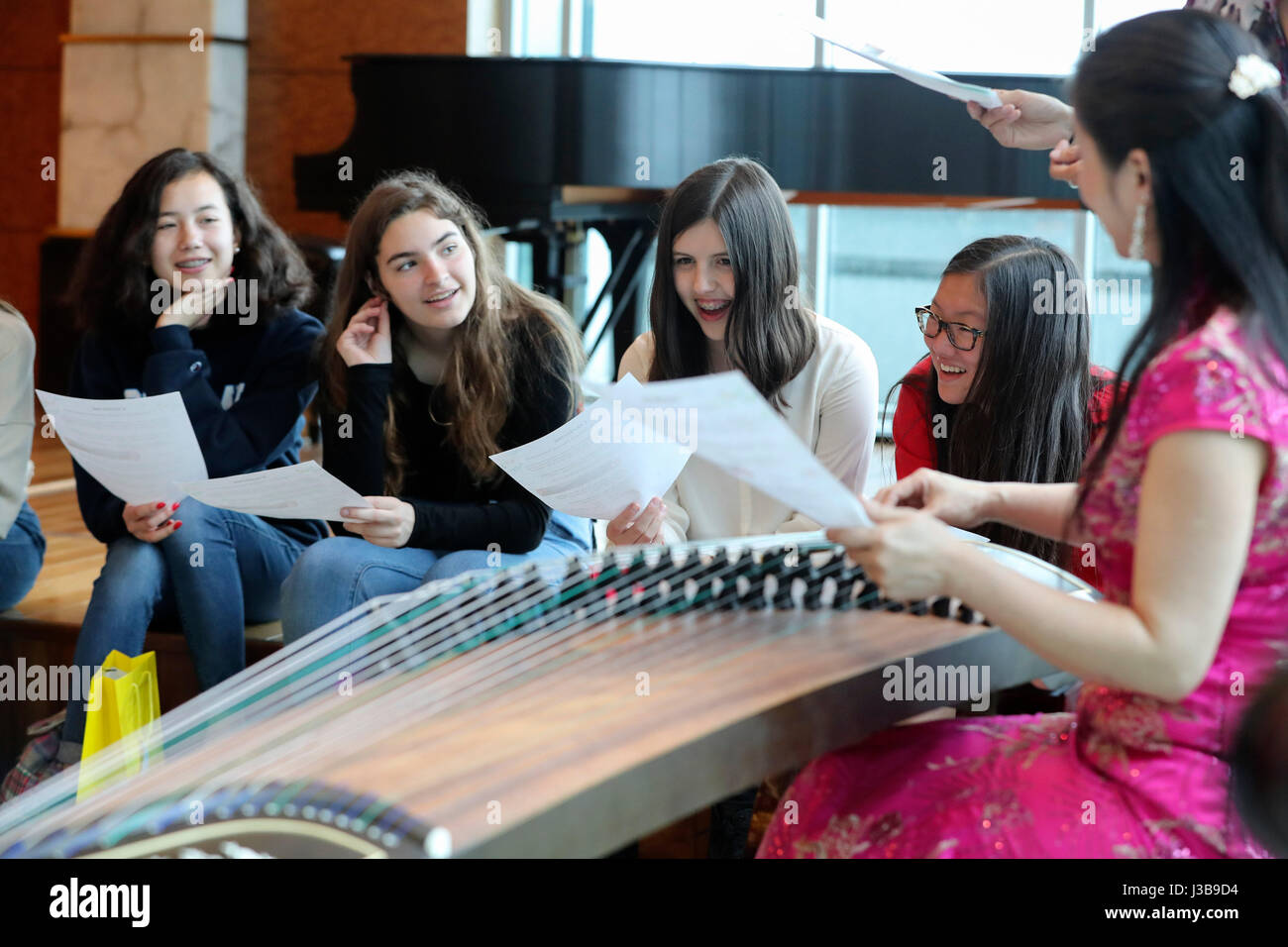 New York, USA. 5th May, 2017. U.S. students learn to play Guzheng, a