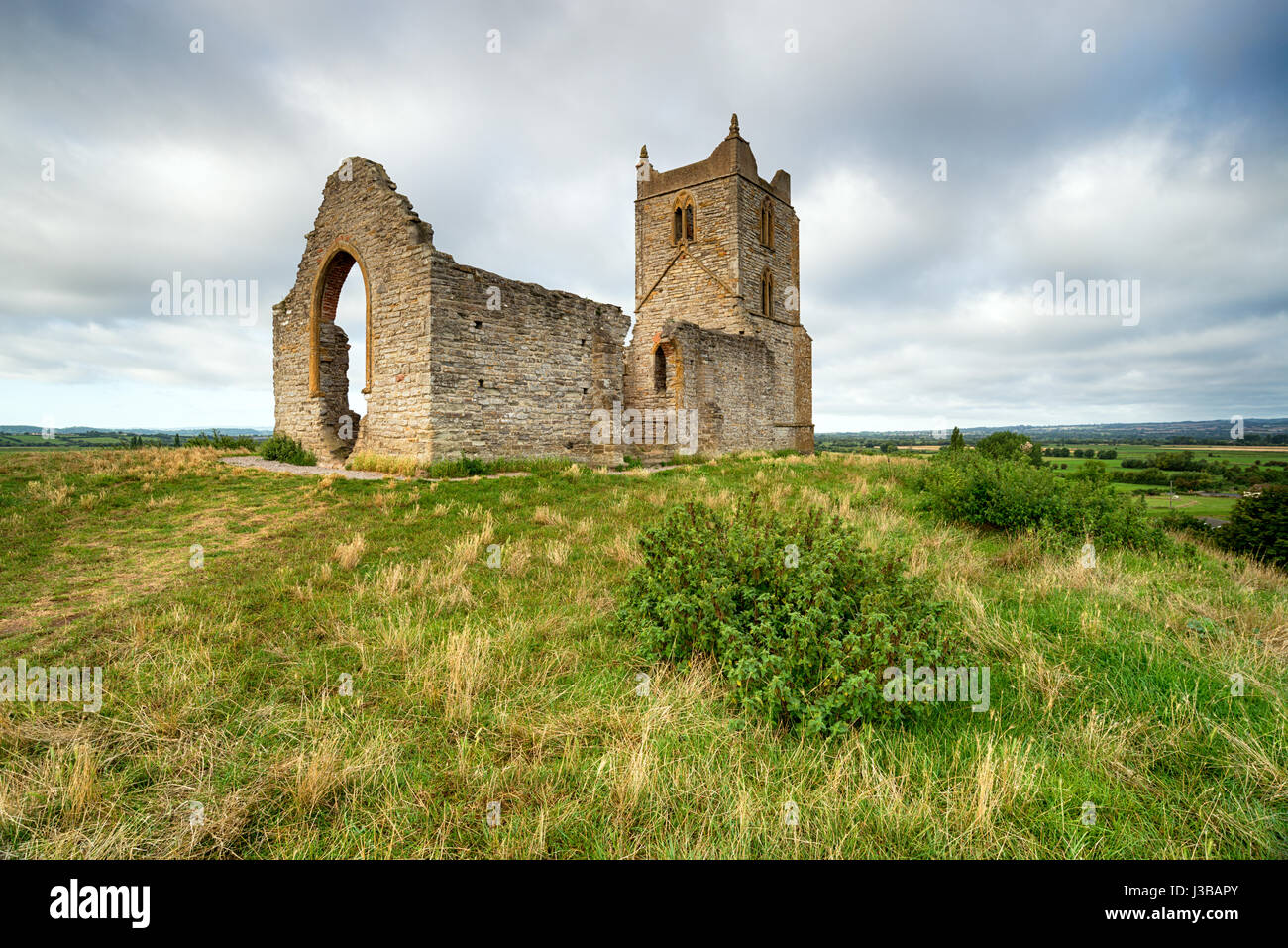 The ruins of St Michael's Church on the top of Burrow Mump in the Somerset countryside Stock Photo
