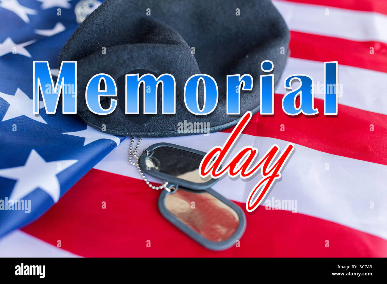 memorial day over american flag, hat and dog tag Stock Photo