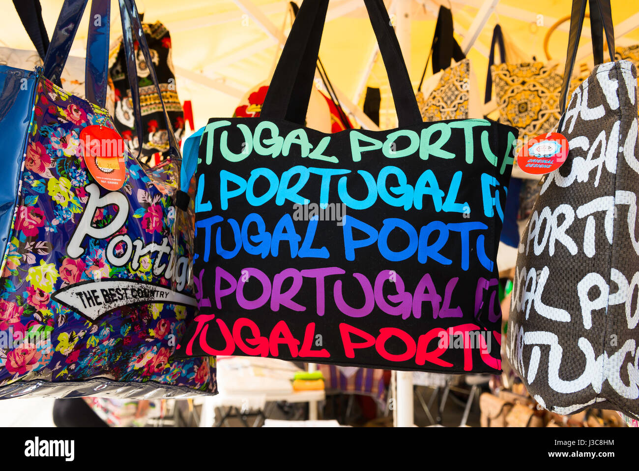 Porto Portugal shopping, view of a display of colourful souvenir bags  outside a shop in the Ribeira area of Porto, Portugal, Europe Stock Photo -  Alamy