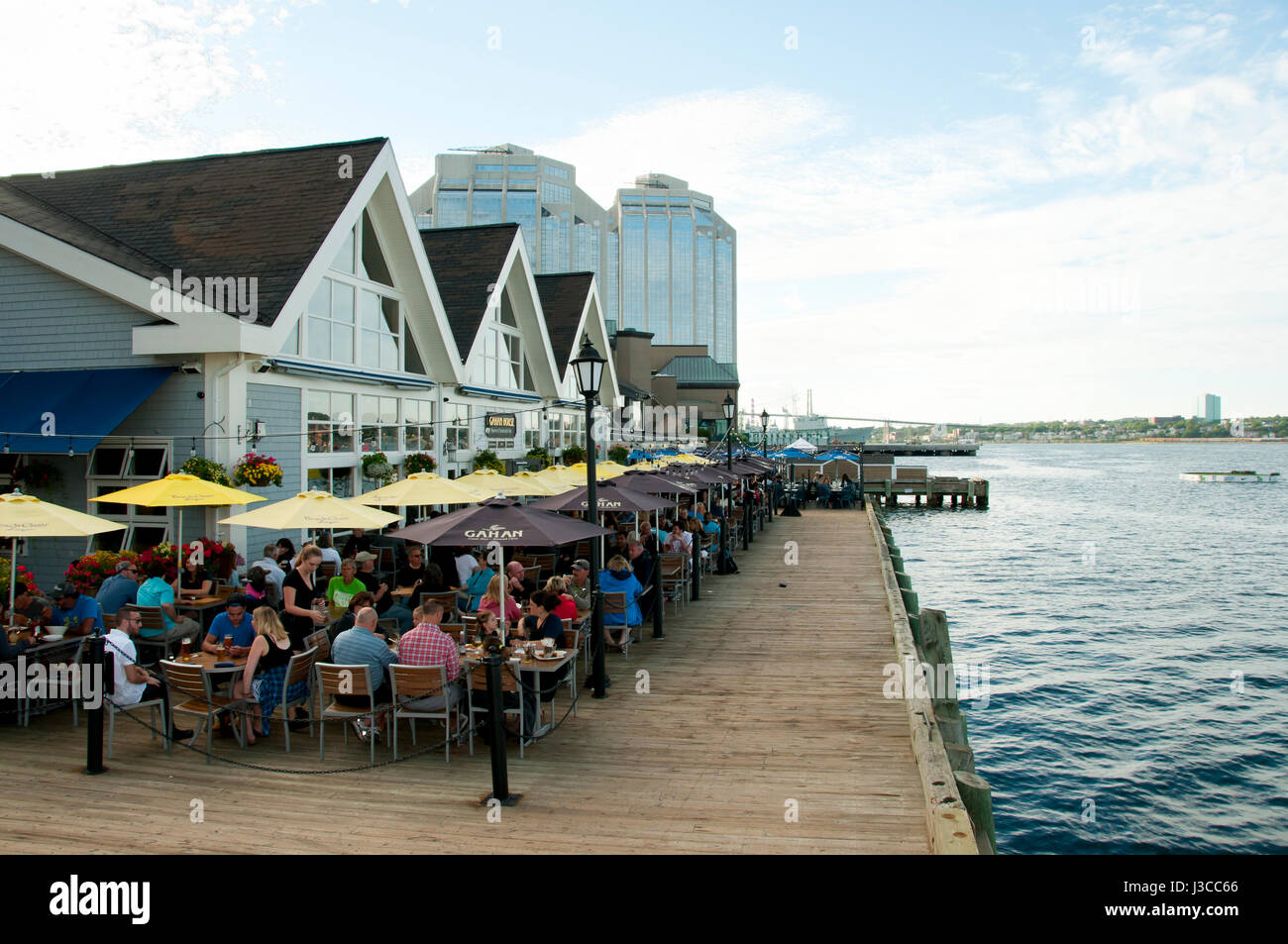 HALIFAX, CANADA - August 13, 2016:  The Halifax Waterfront Boardwalk is a public footpath and a tourist destination popular for its shops and restaura Stock Photo