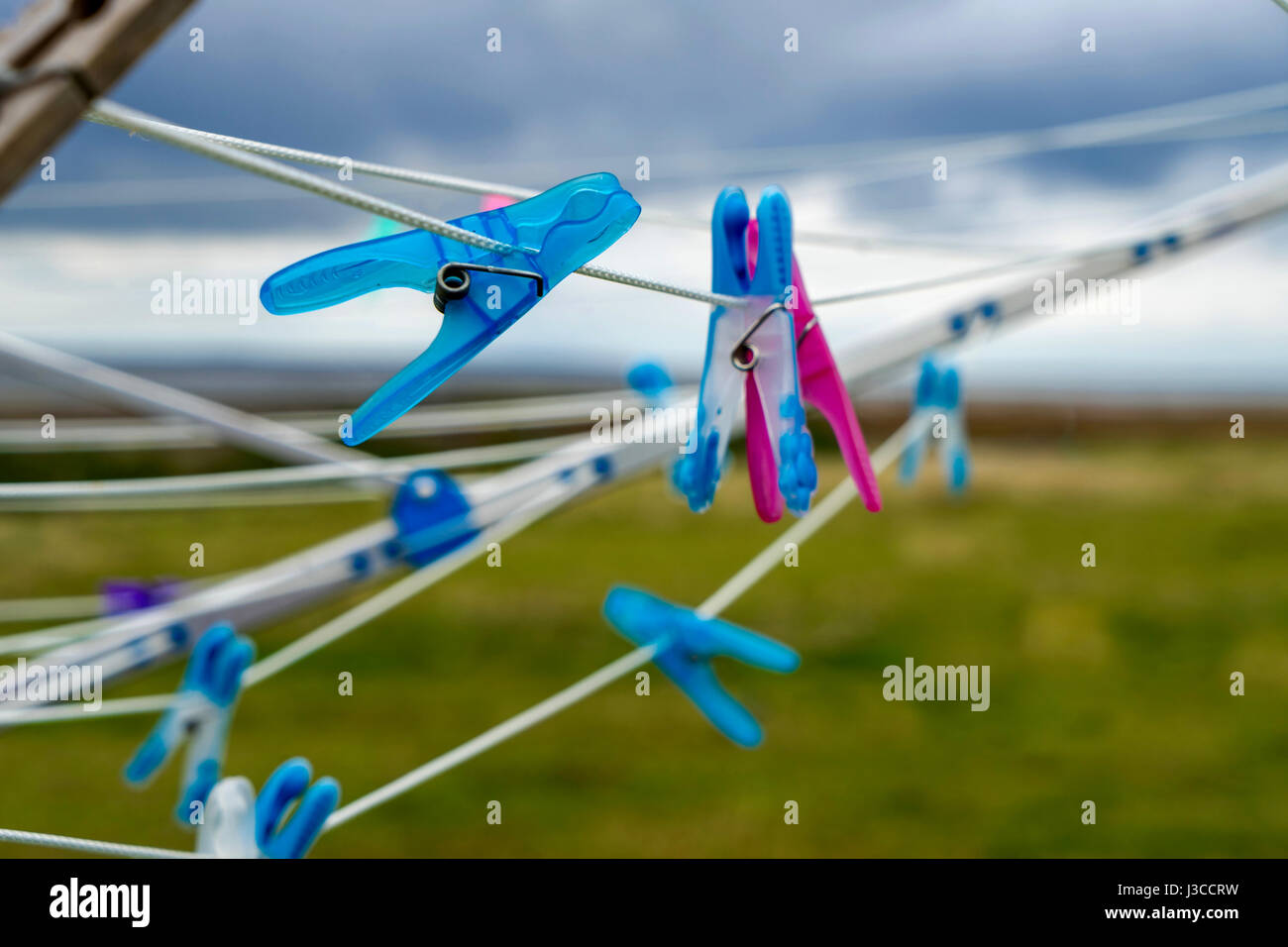 Two babies are born: Clotheslines with pink and blue clothespins are blowing in the wind on the small North Frisia island Amrum, Germany Stock Photo