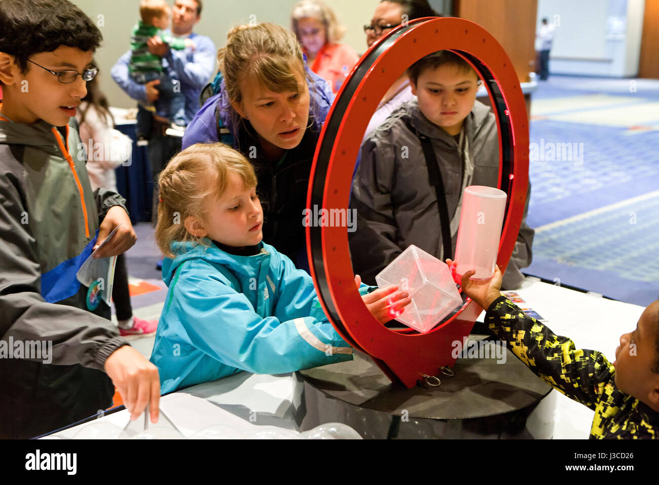 Children learning math at interactive stations at math fair - USA Stock Photo