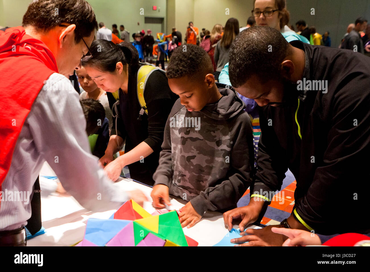 Children learning math at interactive stations at math fair - USA Stock Photo