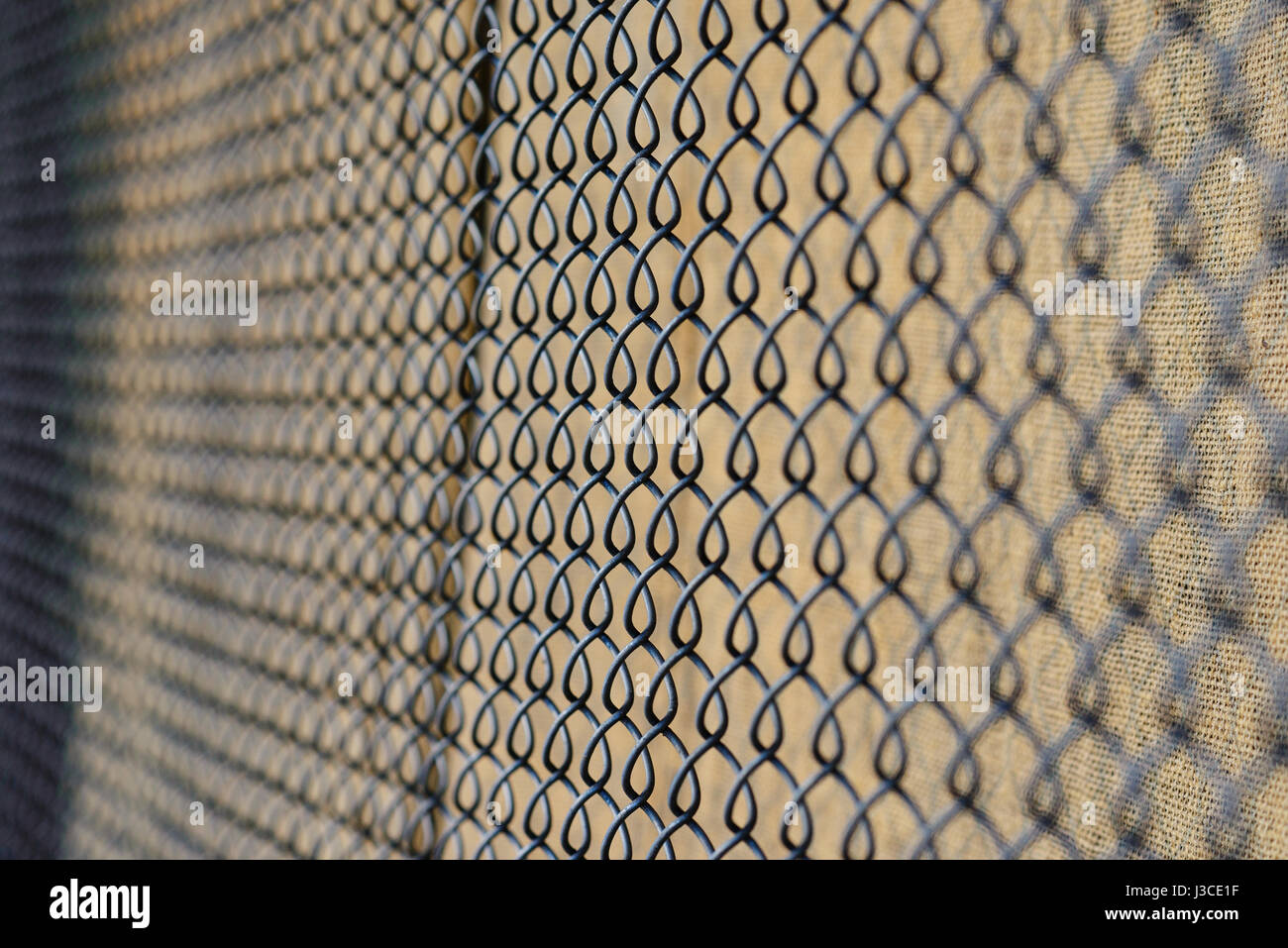 fence with metal grid in perspective, background Stock Photo - Alamy