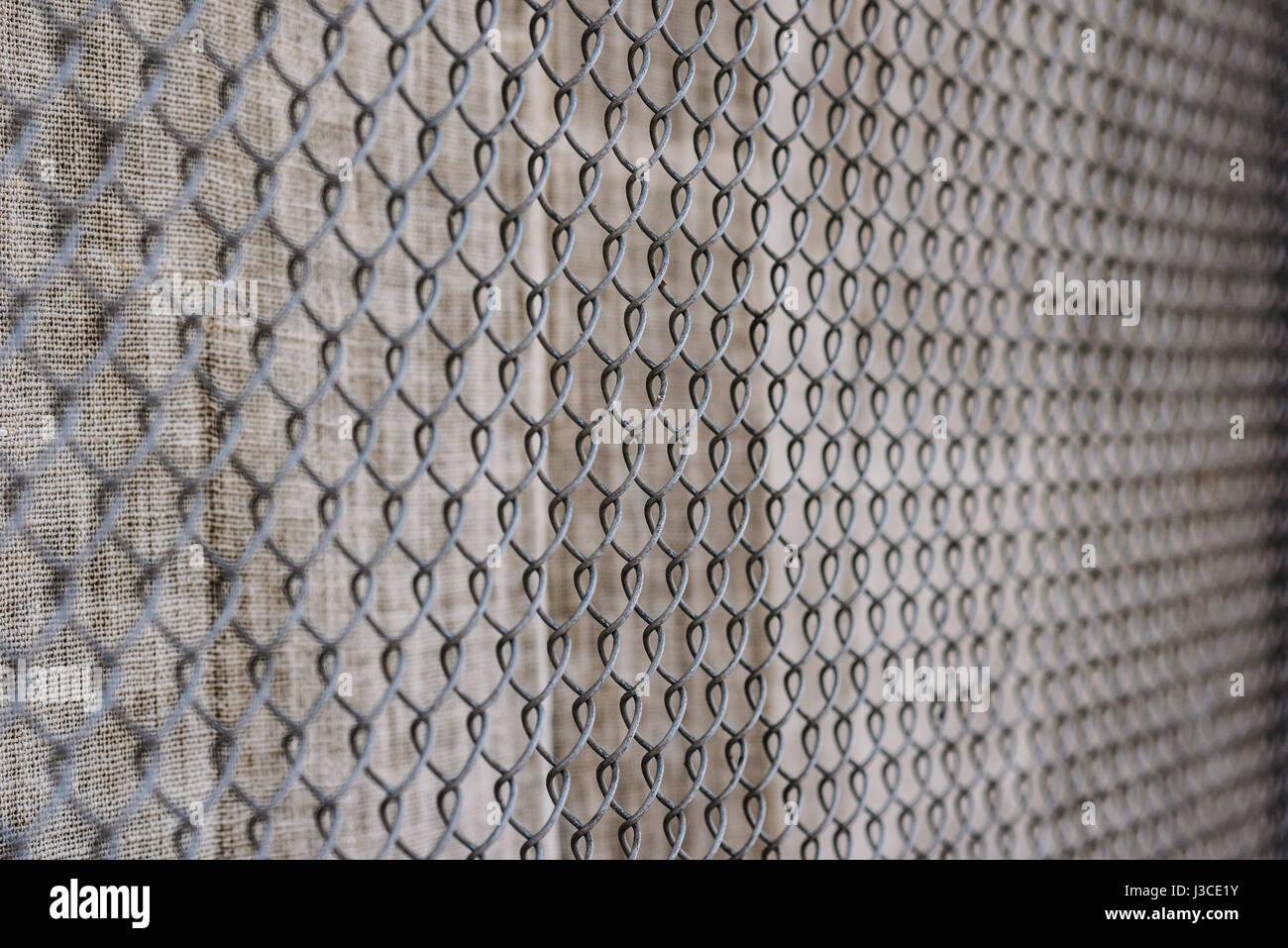 fence with metal grid in perspective, background Stock Photo - Alamy
