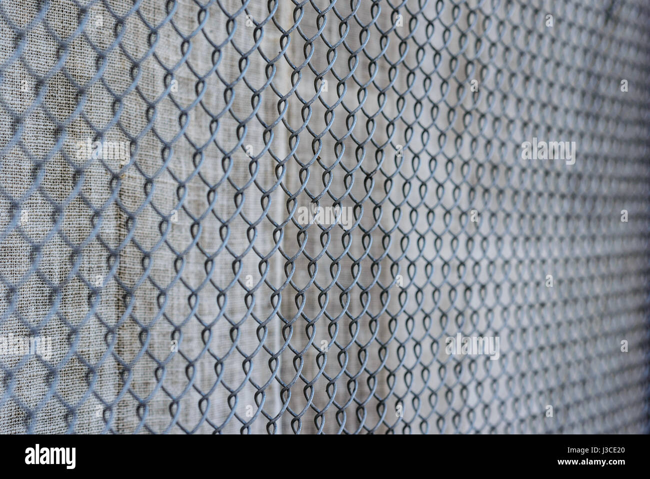 fence with metal grid in perspective, background Stock Photo - Alamy