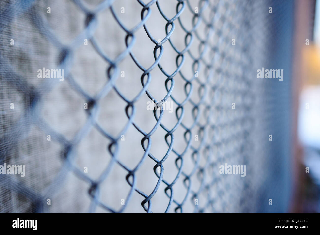 fence with metal grid in perspective, background Stock Photo - Alamy
