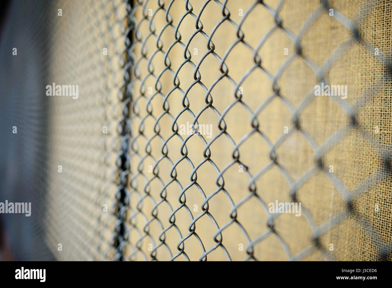 fence with metal grid in perspective, background Stock Photo - Alamy