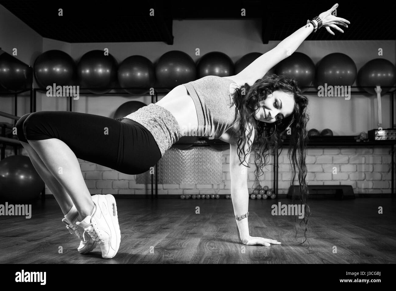 Fitness girl dancing zumba workout in gym. Weight loss activity exercises Stock Photo