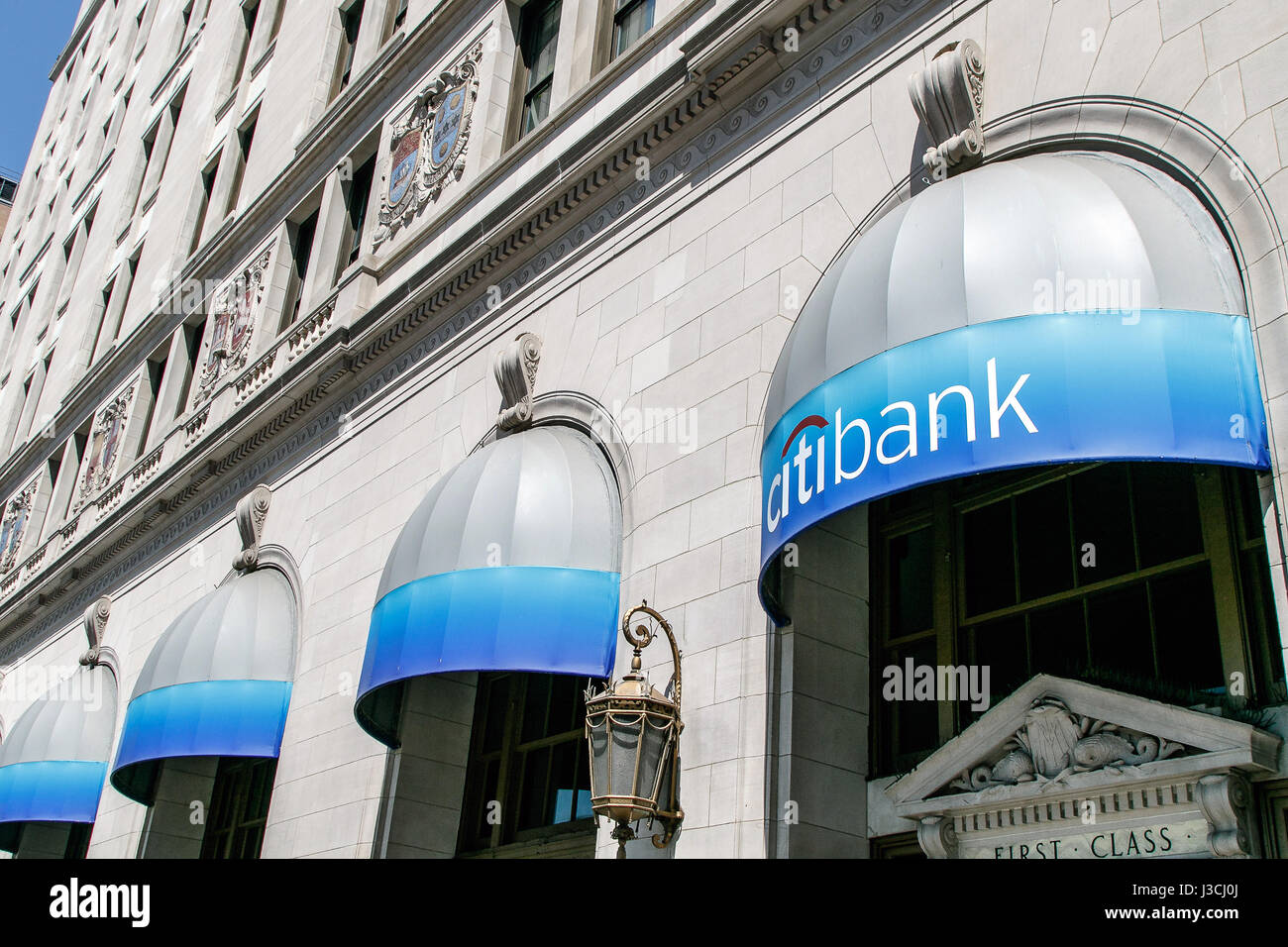 Awnings carrying Citibank corporate colors and signage at one of their retail locations in Manhattan. Stock Photo