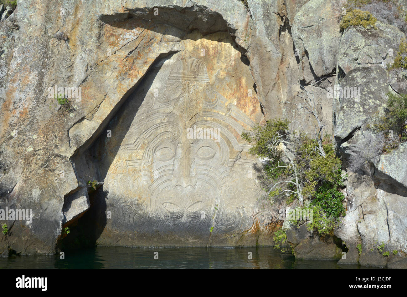 Maori Rock Carving at lake Taupo in the North Island of New Zealand Stock Photo