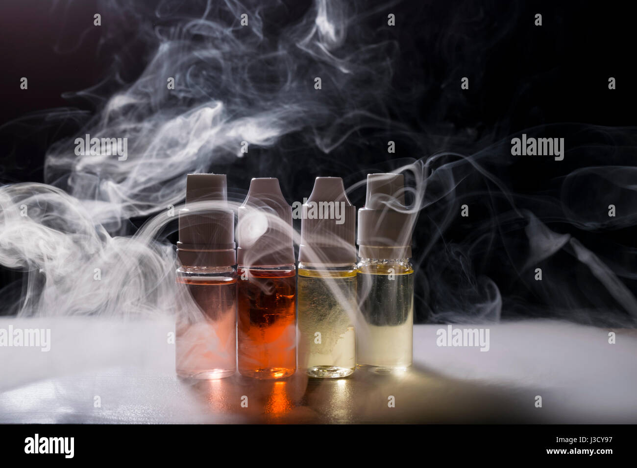isolated vape e liquid for electronic cigarette with lots of clouds Stock Photo