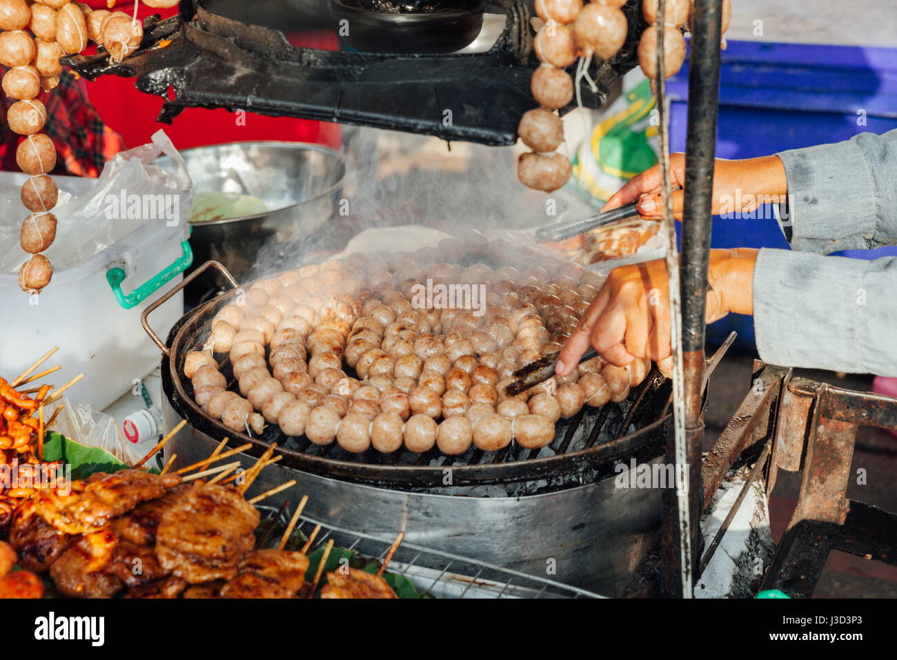 Chiang Mai Thailand August 21 Thai Woman Cooks Meatballs At The Sunday Market Walking Street On August 21 16 In Chiang Mai Thailand Stock Photo Alamy