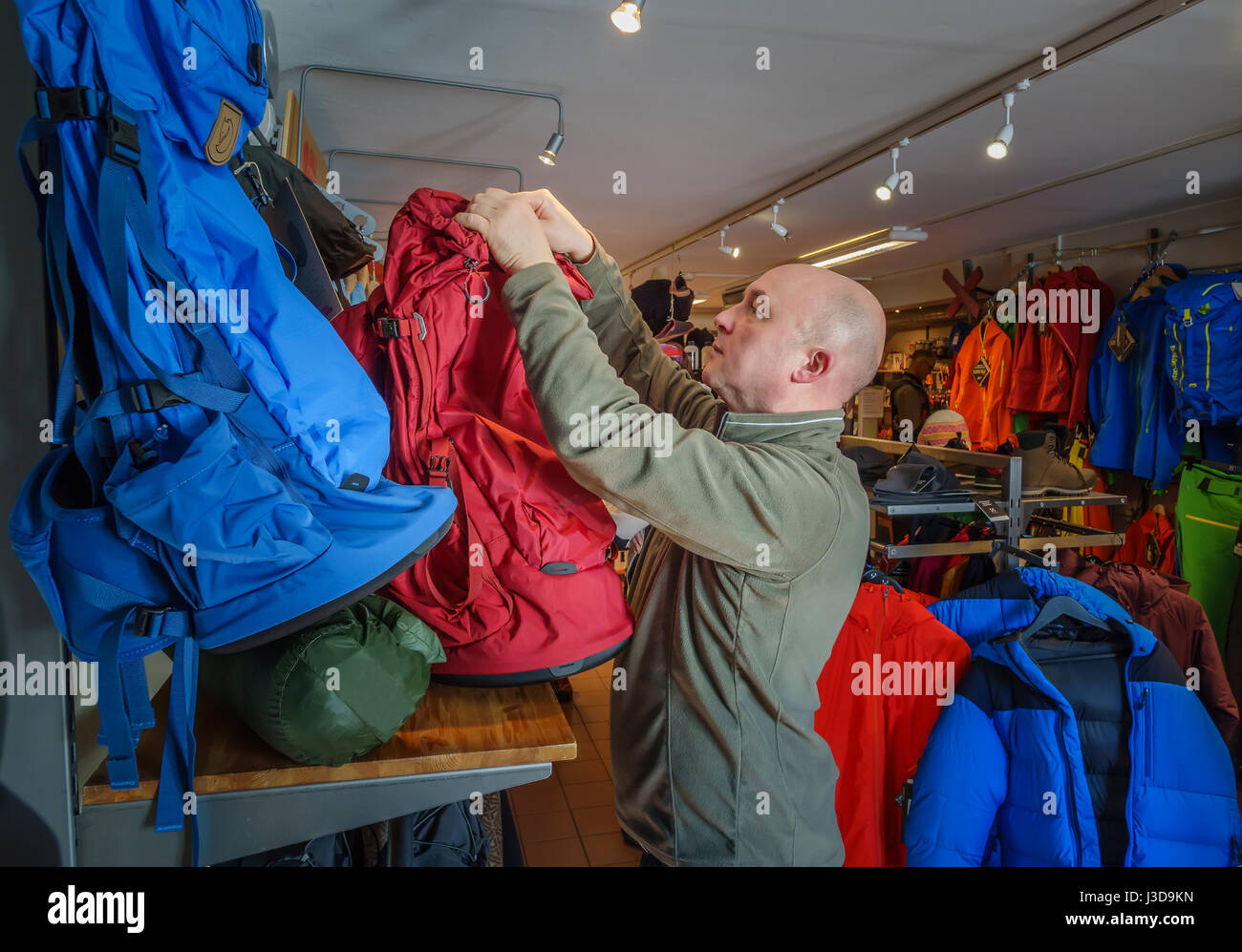 Man shopping for a backpack Stock Photo