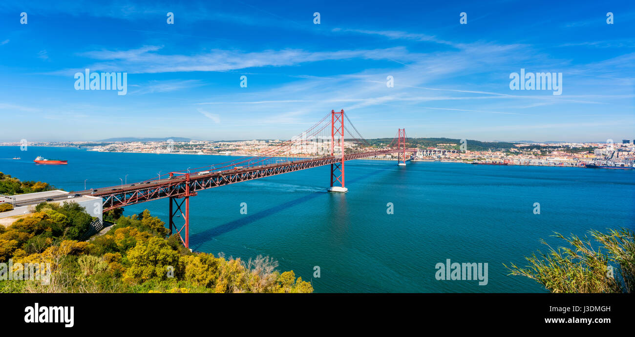 Panoramic view on the April 25th Bridge crossing the Tagus river in Lisbon, capital of  Portugal Stock Photo