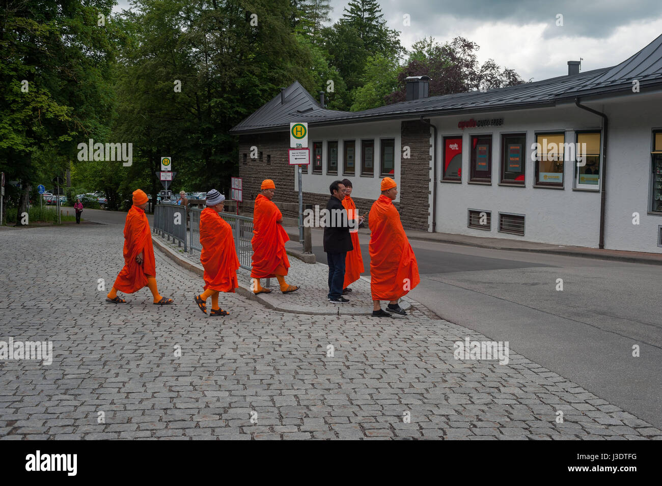 GERMANY. Bavaria. 2016. Buddhist monks at Neuschwanstein Castle Stock Photo