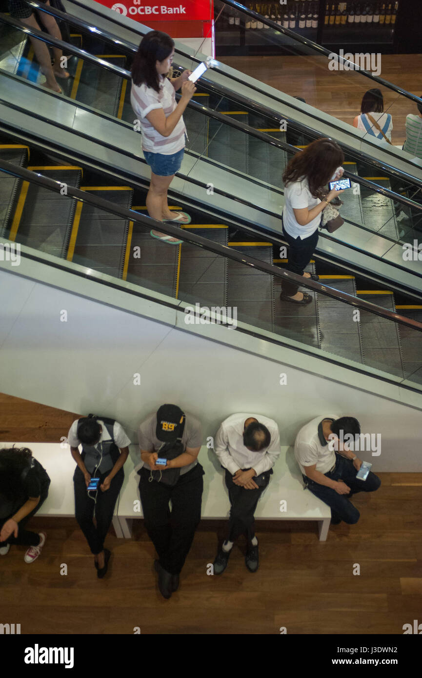 Singapore, Republic of Singapore, 2016, People at the ION Orchard Shopping Mall Stock Photo