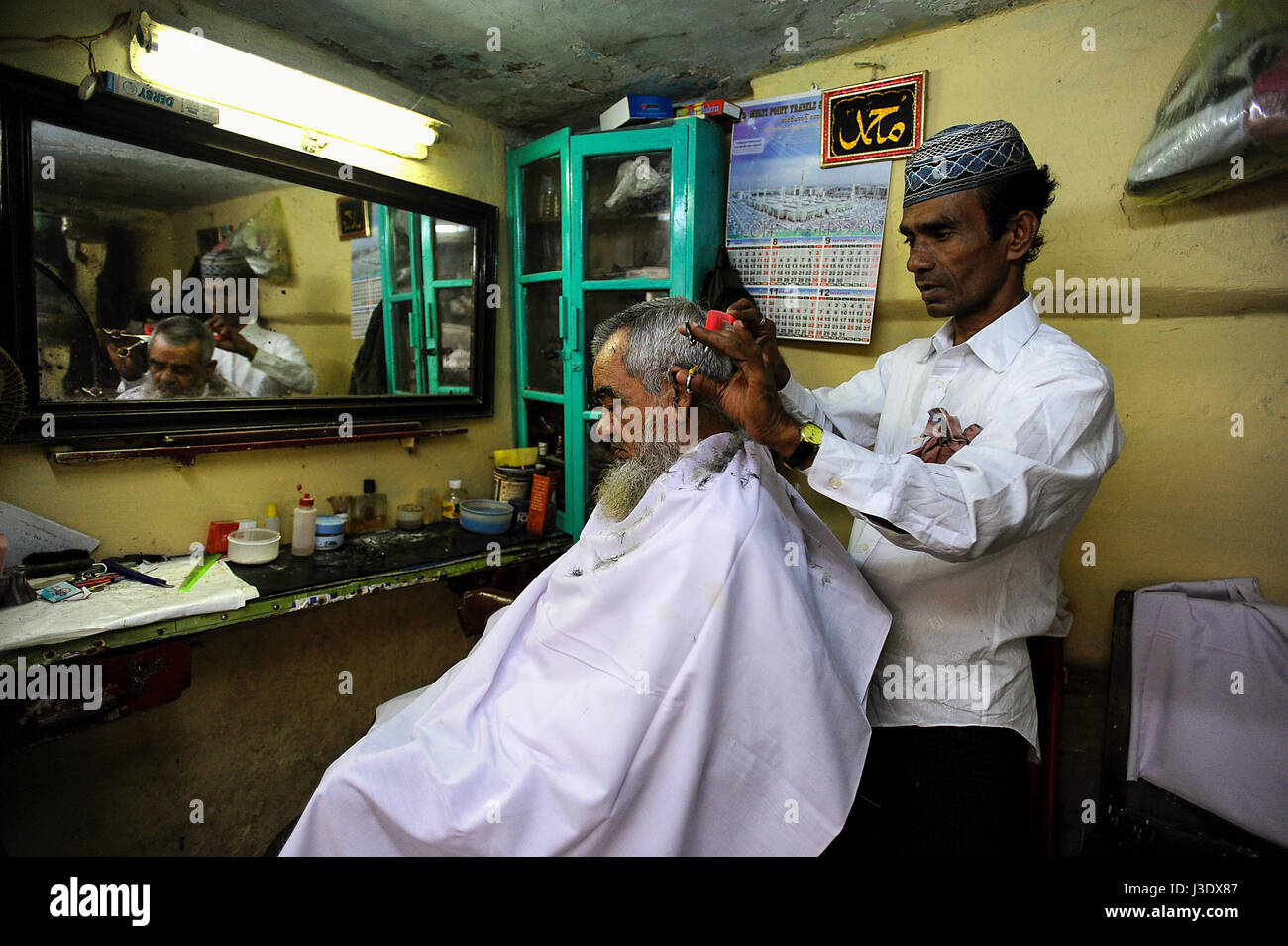 Yangon, Myanmar, Asia, A Muslim barber in Yangon Stock Photo